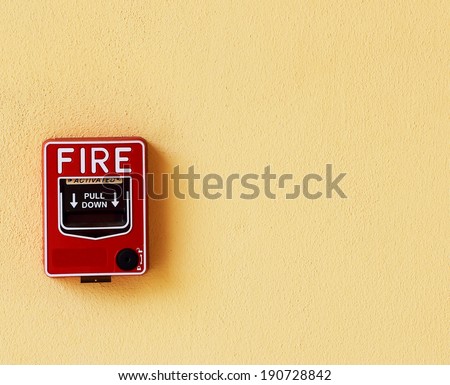 fire break glass alarm switch on the wall