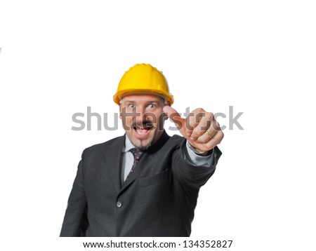 Energetic man happened on the work.  It puts on a helmet of protection.  Isolated on white background.  Holds the thumbs up.