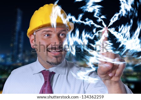 Man touches a point. Lightning at night