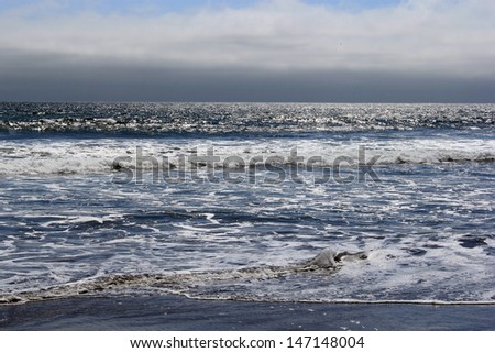 Ocean waves on a cool cloudy day