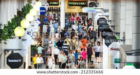 Italy Prato 27 july 2014 - People walk in a gallery of a commercial center in Prato, Italy.