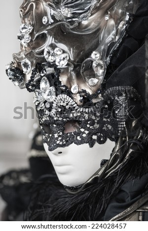 beautiful and mysterious portrait of a mask during venice carnival - italy
