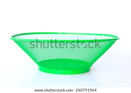Close-up of steel basket isolated on white background