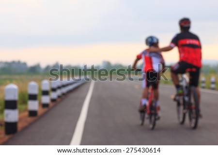 Family cycling outdoors