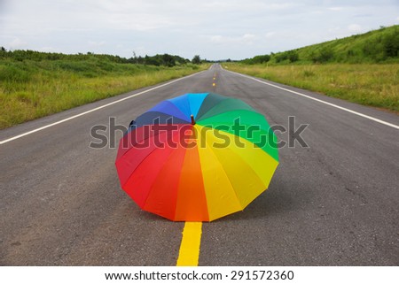 rainbow umbrella on the road