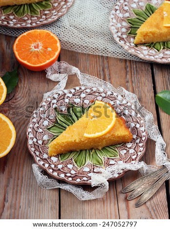 Polenta and lemon butter cake on a vintage plates on a wooden table. Selective focus