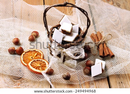 Holidays, love, food and drink concept. Handmade cookies in a basket on a wooden table. Selective focus