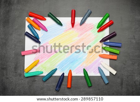 Still life, business, education concept. Abstract drawing with crayons on a dusty chalkboard. Selective focus, copy space background, top view
