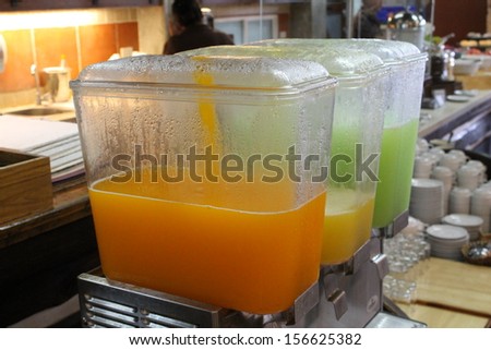 Row of fresh juice at buffet hotel restaurant.