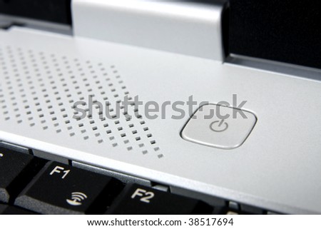 Close up of the power on and off button on a laptop