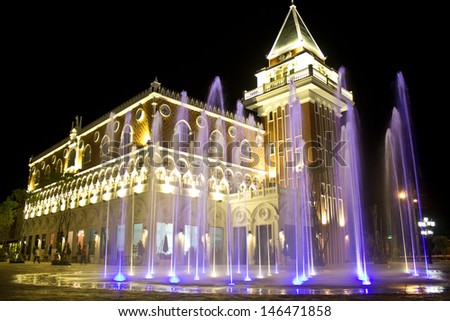 coloured jets water of fountain and the Main Guard building by night in the Venezie Huahin Thailand