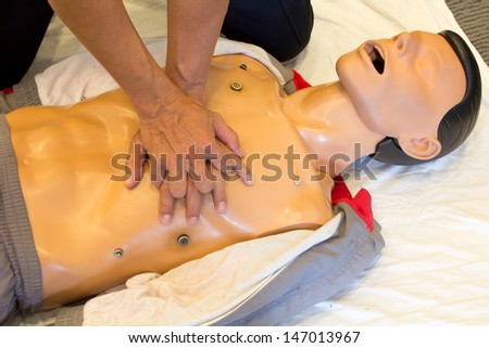 The man on a  training to do Cardiopulmonary resuscitation