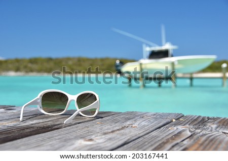 Sunglasses on the wooden jetty. Exuma, Bahamas