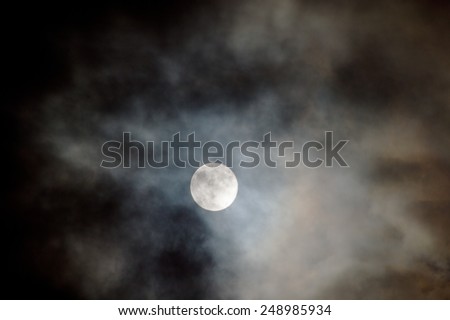 interesting full moon in a cloudy night
