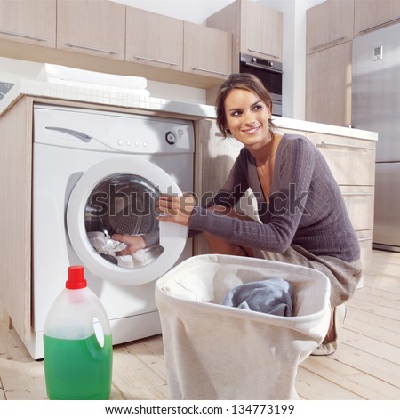 pretty smiling woman in the laundry room