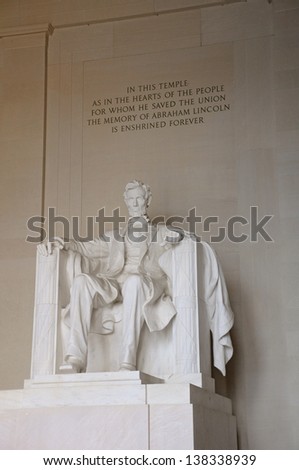 A statue of Abraham Lincoln inside of the Lincoln Memorial in Washington DC