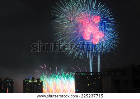 A firework display over the modern buildings at night in Pudong new area of Shanghai China during China\'s national day holiday.from Century Park.