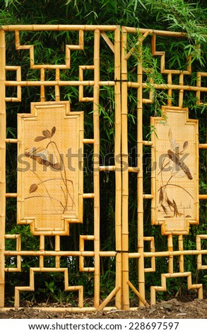 Bamboo screen with inlaid flowers outside at Guyi Gardens in Shanghai China.