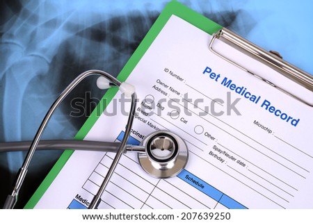 Blank pet medical record and stethoscope.