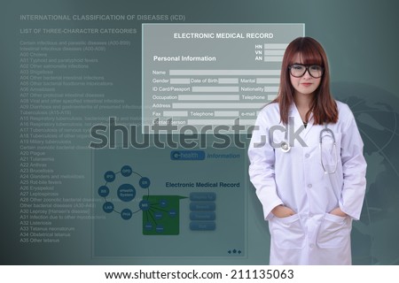 Female doctor stand in front of electronic health system background.