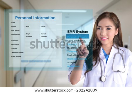 Female doctor using electronic medical record system to search patient information.