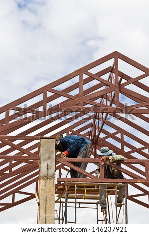 Steel frame of house roof under construction.