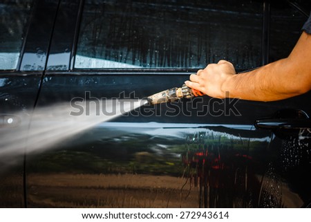 Car wash  with high pressure cleaners in action