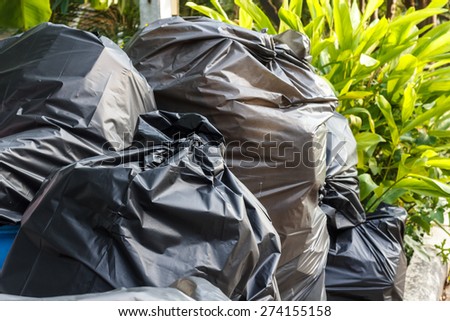 Stack of black garbage bags.Black plastic bags for packaging waste.