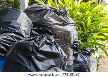 Stack of black garbage bags.Black plastic bags for packaging waste.