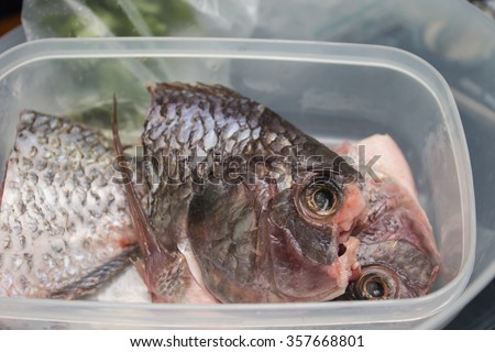 Sliced fish on a Food Packing Box.