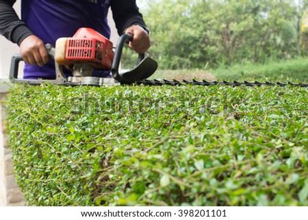 Workers were using mower for Gardening.(selective focus)