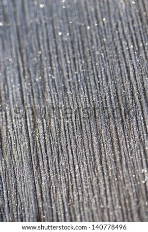 Wood grain with winter frost sparkles background
