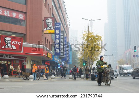 SHENYANG, CHINA - OCTOBER 31, 2014: People walking on street in a heavy hazy weather morning. Located in Sanhao Street, Shenyang City, Liaoning Province, China.