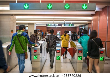 BEIJING, CHINA - OCTOBER 24, 2014: People coming out of Metro exits. Located in Beijing Subway, Beijing, China.