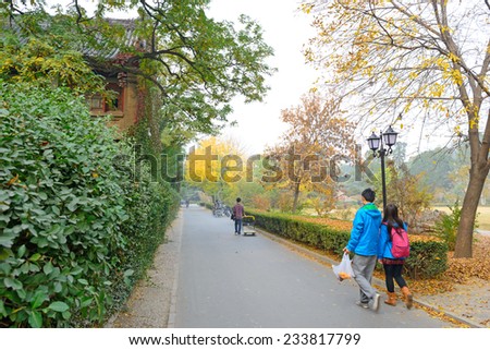 Students walking in campus. Located in Peking University, Beijing, China.