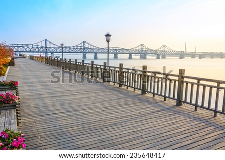 Yalu River Bridge and Yalu River Scenic Areas at morning. Located in Dandong City, Liaoning province, China.