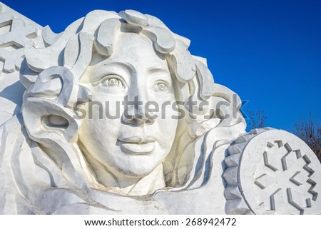 Harbin, China - January 11, 2015: Snow girl sculpture. 27th China Harbin Sun Island International Snow Sculpture Art Expo. Located in Harbin City, Heilongjiang Province, China.