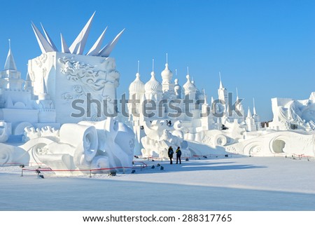 Harbin, China - January 11, 2015: Snow building. People are visiting. 27th China Harbin Sun Island International Snow Sculpture Art Expo. Located in Harbin City, Heilongjiang, China.