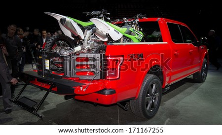 Detroit, Mi/Usa - January 13: A 2014 Ford F150 Fx4 Truck Carrying Two Kawasaki Kx-85 Dirt Bikes At The North American International Auto Show (Naias) On January 13, 2014, In Detroit, Michigan.