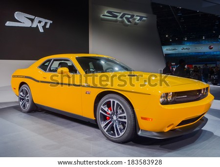 DETROIT, MI/USA - JANUARY 15, 2012: A 2012 Dodge Challenger Yellow Jacket car on display at the North American International Auto Show (NAIAS).