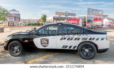 ROYAL OAK, MI/USA - AUGUST 15, 2014: A Dodge Charger Police car at the Woodward Dream Cruise. The Cruise is the world\'s largest one-day automotive event. Woodward (M-1) is a National Scenic Byway.