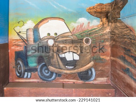 TUCUMCARI, NM/USA - MAY 9, 2013: Route 66 mural depicts cartoon character Sir Tow Mater (an  International Harvester boom truck) from the Pixar movie Cars at the Blue Swallow Motel.