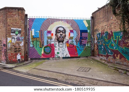 LONDON, UNITED KINGDOM - JANUARY 12, 2014: Shoreditch, in the heart of the trendy East End of London, has become synonymous with the UK street art scene, attracting visitors from all over the world.