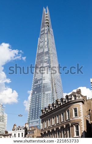 LONDON, UNITED KINGDOM - MAY 14, 2014: The Shard rises high above street level at London Bridge.