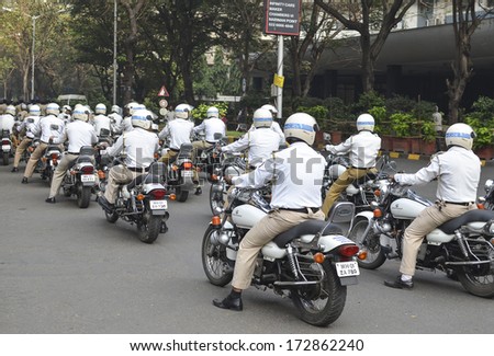 Mumbai, India - January 23, 2014 - Traffic Police riding motorbicycles  parading near Marine Drive  during the rehearsal on 23 January 2014 for India\'s Republic Day to be held on 26 January 2014