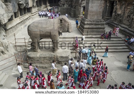 Aurangabad, India - February 14, 2014 - Students and visitors visiting Mount Kailash at Ellora Rock Cut Caves, UNESCO World Heritage site