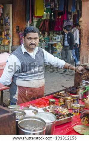 Jaipur, India - February 27, 2014 - Vendor selling paan or betel leaf and betel nut as mouth freshener from their stall along busy street