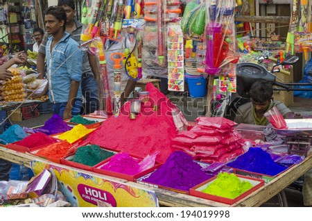 MUMBAI, INDIA - MAR 15, 2014 - Stall selling colorful powder and toys during Holi Festival at local market