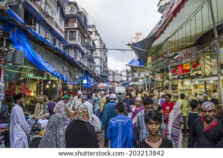 Mumbai, India - July 3, 2014 -  People shopping for food from stalls at at crowded Mohammad Ali Road in the evening during Ramzan fasting month