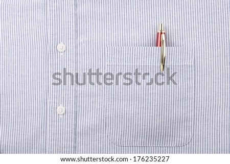 Close Up of the Pocket with Red and Gold Pen and Buttons on a Men\'s Blue Striped Shirt